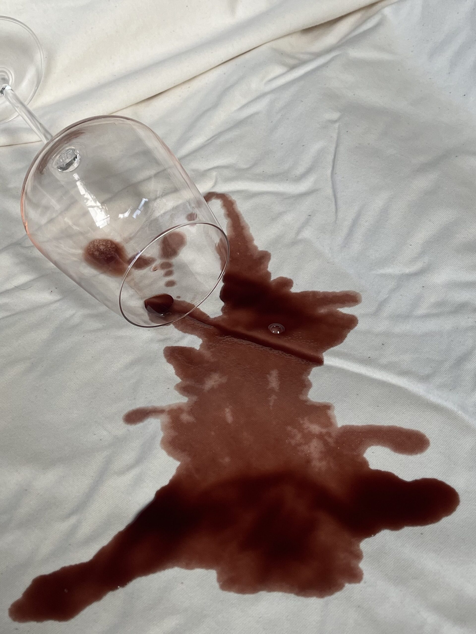 A wine spill on the mattress protector from Happsy