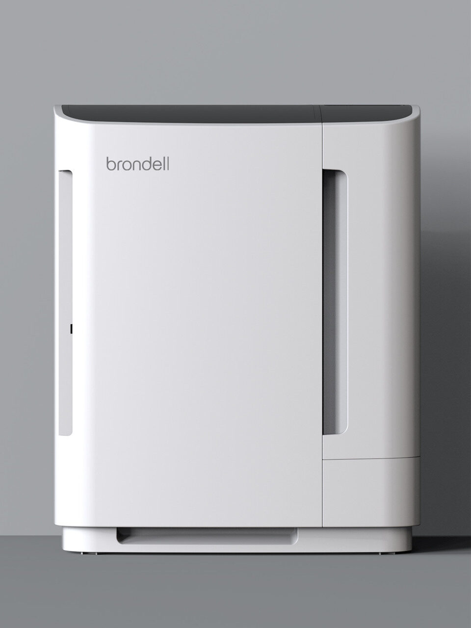White air purifier against a gray wall, featuring a compact, rectangular design with the brand "Brondell" on the front.