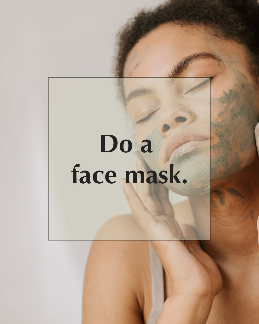 A person with closed eyes applies a green face mask to their cheek. The text overlay reads, "Do a face mask.