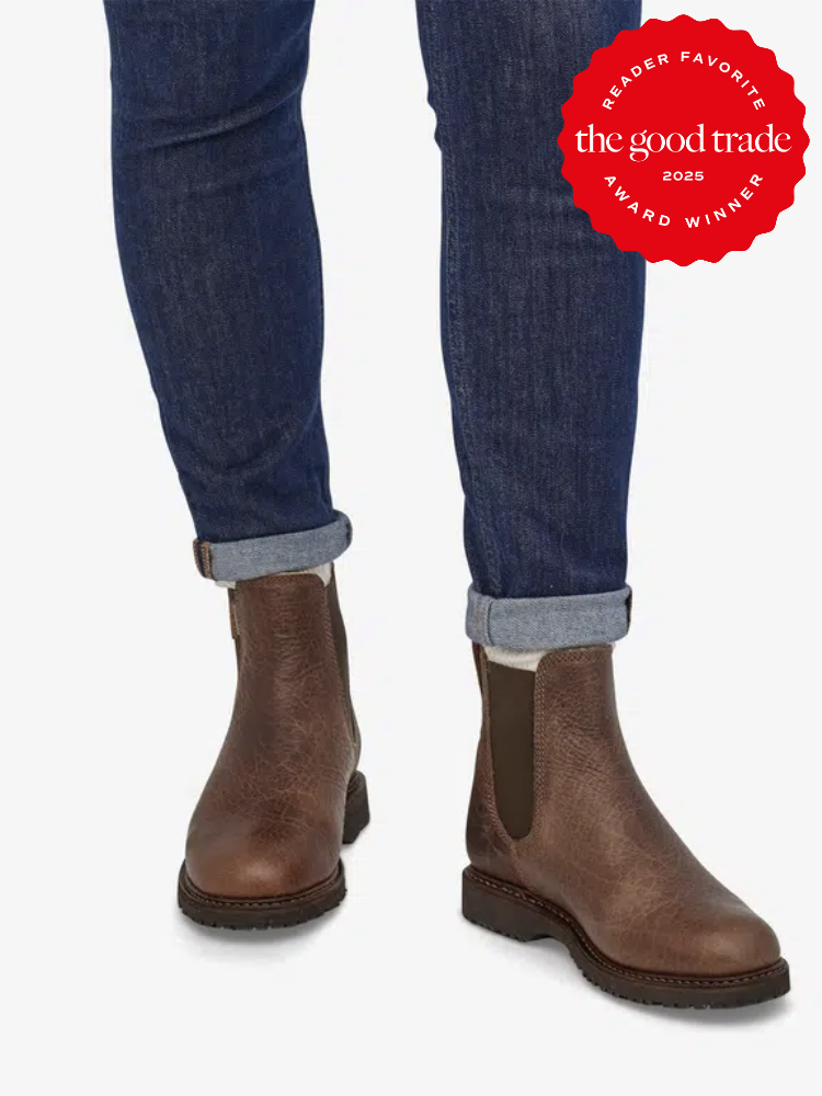 Person wearing brown Chelsea boots and cuffed jeans. Boots are recognized with a "Reader Favorite" award from "The Good Trade" for 2025.
