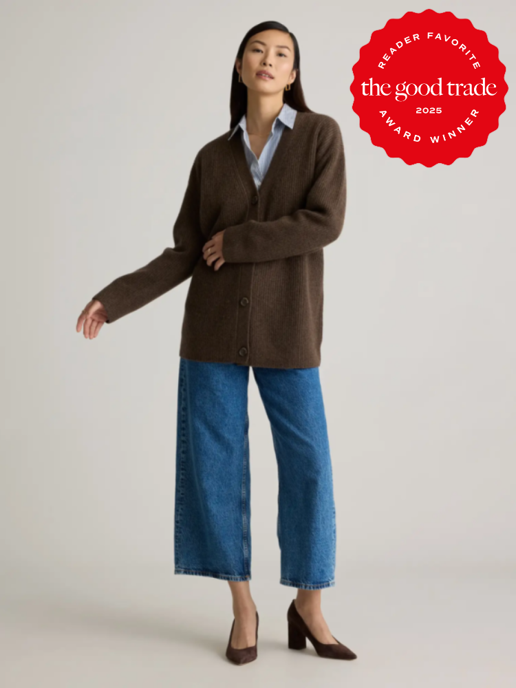 Person wearing a brown cardigan, blue jeans, and heels. A badge in the corner reads "Reader Favorite, the good trade, 2025 Award Winner.