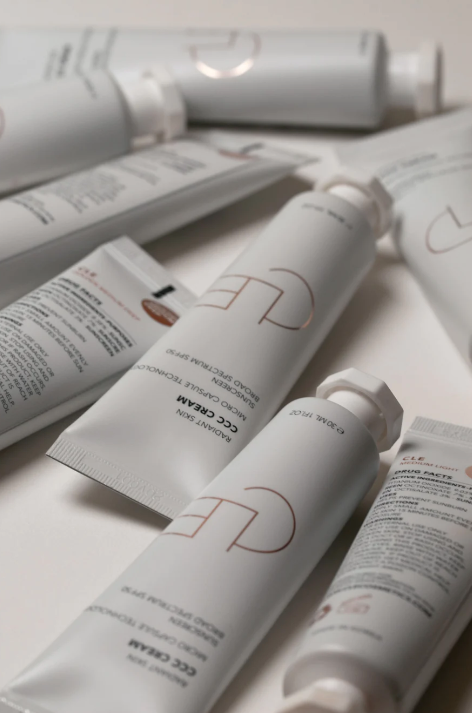 A close up of many bottles of CC Cream.